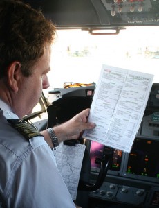 Pilot With Plane-Parking Checklist, cc-by, curimedia.